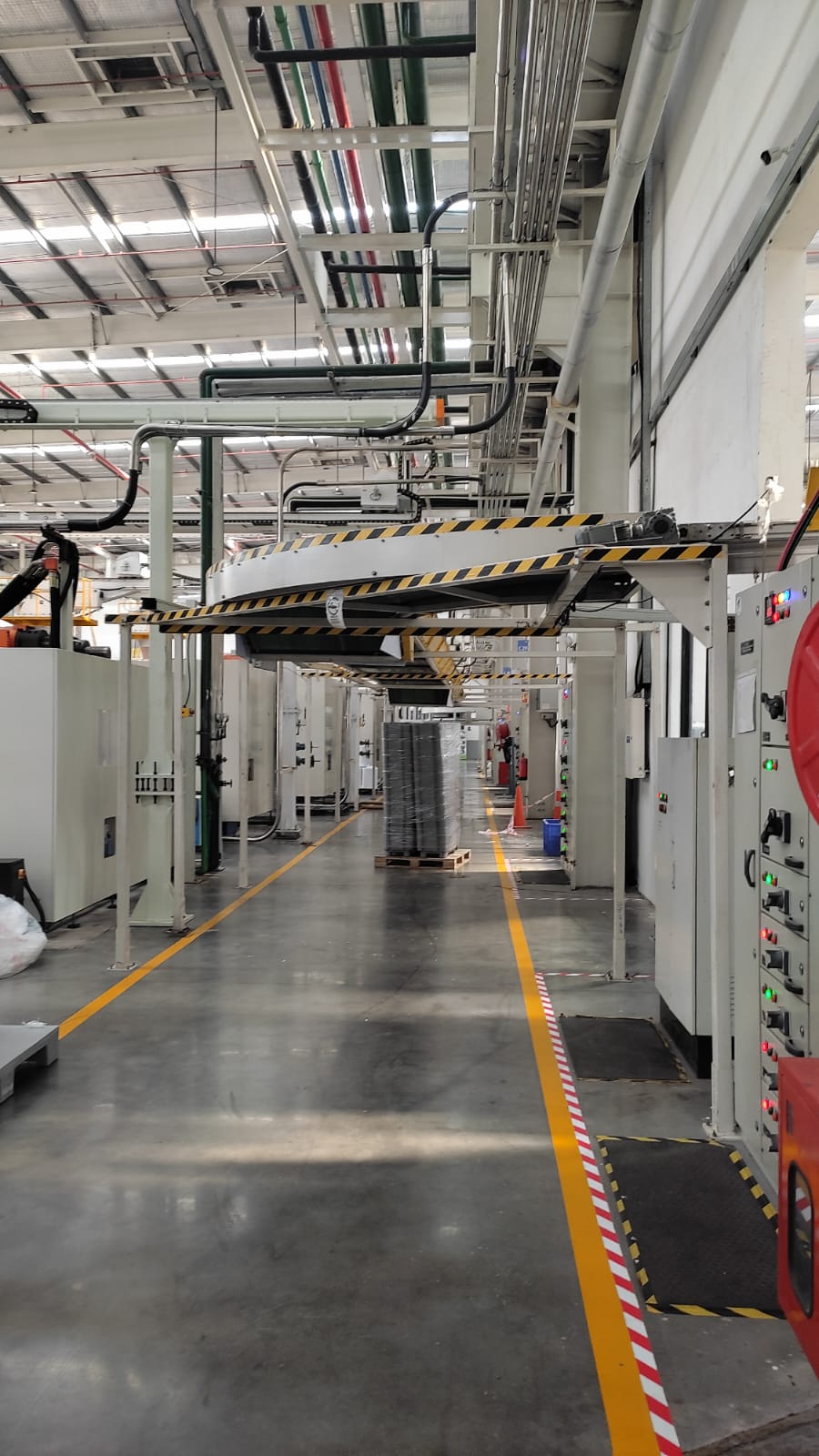 Warehouse International's Injection Moulding Material Transfer Line seamlessly integrated into Haier's Pune facility, optimizing production layout